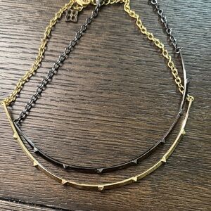 Set of gold and gunmetal necklaces